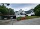 White brick home with attached two-car garage and deck at 2198 Indian Shoals Dr, Loganville, GA 30052