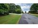 Residential street with lush landscaping at 2198 Indian Shoals Dr, Loganville, GA 30052