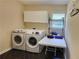 Laundry room with washer, dryer, and additional storage at 2198 Indian Shoals Dr, Loganville, GA 30052