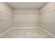 Spacious walk-in closet with ample shelving at 2408 Meadow Church Rd, Duluth, GA 30097