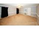 Large main bedroom with neutral walls, hardwood floors and ensuite bathroom at 2533 Whispering Pines Dr, Grayson, GA 30017