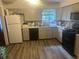 Galley kitchen with light cabinets at 6354 Shannon Pkwy # 12F, Union City, GA 30291