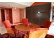 Bright dining area with a round table and four orange chairs at 88 W Paces Ferry Nw Rd # 1130, Atlanta, GA 30305