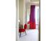 Bedroom with red chair and red and fuchsia curtains at 88 W Paces Ferry Nw Rd # 1130, Atlanta, GA 30305