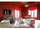 Sophisticated office with red walls, white chairs, and a large flat-screen TV at 88 W Paces Ferry Nw Rd # 1130, Atlanta, GA 30305