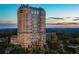 Aerial view of a luxury high rise building at sunset at 88 W Paces Ferry Nw Rd # 1130, Atlanta, GA 30305