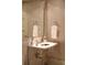 Small bathroom with a pedestal sink and geometric wallpaper at 88 W Paces Ferry Nw Rd # 1130, Atlanta, GA 30305