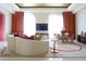 Elegant living room with curved sofa, large TV, and stylish decor at 88 W Paces Ferry Nw Rd # 1130, Atlanta, GA 30305