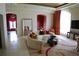 Elegant living room with curved sofa, large windows, and access to adjacent rooms at 88 W Paces Ferry Nw Rd # 1130, Atlanta, GA 30305