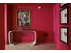 Hallway with pink walls, artwork, and white herringbone floors at 88 W Paces Ferry Nw Rd # 1130, Atlanta, GA 30305