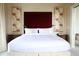 Spacious bedroom with a king-size bed and stunning floral artwork at 88 W Paces Ferry Nw Rd # 1130, Atlanta, GA 30305