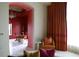 Game room with a red accent wall and access to the living room at 88 W Paces Ferry Nw Rd # 1130, Atlanta, GA 30305