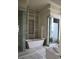 Spa-like bathroom with a soaking tub, walk-in shower, and marble flooring at 88 W Paces Ferry Nw Rd # 1130, Atlanta, GA 30305