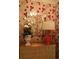 Entryway with red floral wallpaper, a mirror, and a lamp at 88 W Paces Ferry Nw Rd # 1130, Atlanta, GA 30305