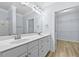 Double vanity bathroom with a large mirror and access to a walk-in closet at 1850 Cotillion Dr # 2323, Atlanta, GA 30338