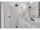 Clean bathroom with white subway tile shower, single vanity, and dark floor tile at 2228 Old Dallas Sw Rd, Marietta, GA 30064