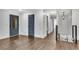 Spacious hallway with dark hardwood floors, shiplap walls, and access to multiple rooms at 2228 Old Dallas Sw Rd, Marietta, GA 30064