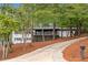 Ranch home nestled in a wooded setting with a long driveway at 2228 Old Dallas Sw Rd, Marietta, GA 30064