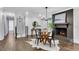 Dining area with a modern table, chairs, and a fireplace at 2228 Old Dallas Sw Rd, Marietta, GA 30064