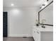 Clean bathroom, featuring a white vanity with quartz countertop and dark accents at 2228 Old Dallas Sw Rd, Marietta, GA 30064