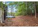Sloped backyard with wooded area and deck access at 2228 Old Dallas Sw Rd, Marietta, GA 30064