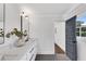 Elegant bathroom with a dual vanity, a large mirror, and dark grey flooring at 2228 Old Dallas Sw Rd, Marietta, GA 30064