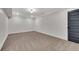 Finished basement room with neutral-colored carpet and a dark gray door at 2228 Old Dallas Sw Rd, Marietta, GA 30064