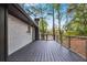 Dark stained deck with cable railing overlooking a wooded area at 2228 Old Dallas Sw Rd, Marietta, GA 30064