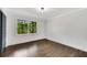 Bright bedroom with hardwood floors and large windows at 2228 Old Dallas Sw Rd, Marietta, GA 30064