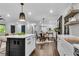 Open kitchen with large island, white cabinets, and dark accents at 2228 Old Dallas Sw Rd, Marietta, GA 30064