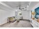 Finished basement with comfortable sitting area and a ceiling fan at 2228 Old Dallas Sw Rd, Marietta, GA 30064