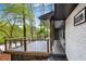 Modern deck with metal railing overlooking a wooded area at 2228 Old Dallas Sw Rd, Marietta, GA 30064