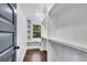 Large walk-in closet with built-in shelves, rods and a window for natural light at 2228 Old Dallas Sw Rd, Marietta, GA 30064