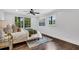 Bright bedroom with dark hardwood floors, ceiling fan, and ample natural light at 2228 Old Dallas Sw Rd, Marietta, GA 30064