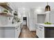 White kitchen cabinets, quartz countertops, and stainless steel appliances at 2228 Old Dallas Sw Rd, Marietta, GA 30064