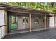 Inviting front porch with a green door and wood columns at 2228 Old Dallas Sw Rd, Marietta, GA 30064