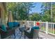 Relaxing deck with wicker furniture, offering wooded views at 4693 Hairston Crossing Rd, Stone Mountain, GA 30083