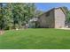 Two-story house with large deck and lush lawn at 4693 Hairston Crossing Rd, Stone Mountain, GA 30083
