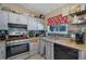 Bright kitchen features stainless steel appliances and ample cabinet space at 4693 Hairston Crossing Rd, Stone Mountain, GA 30083