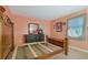 Bedroom with a wooden frame bed and dresser at 4693 Hairston Crossing Rd, Stone Mountain, GA 30083