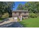 Two story house with attached garage and a green lawn at 4693 Hairston Crossing Rd, Stone Mountain, GA 30083