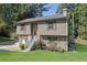 Two story house with attached garage and a green lawn at 4693 Hairston Crossing Rd, Stone Mountain, GA 30083