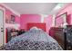 Bedroom with a red headboard and geometric bedding at 4693 Hairston Crossing Rd, Stone Mountain, GA 30083