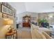 Open living area with a stone fireplace and lots of natural light at 4693 Hairston Crossing Rd, Stone Mountain, GA 30083