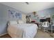 Well-lit bedroom with a queen bed and a workspace at 4693 Hairston Crossing Rd, Stone Mountain, GA 30083