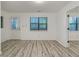 Living room with wood-look floors, white walls, and access to patio at 226 Mill Ct, Dallas, GA 30157