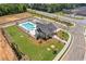 Community pool with clubhouse and surrounding landscaping at 950 Elwood St, Dacula, GA 30019