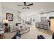 Open concept living room featuring a neutral color palette and modern furniture at 950 Elwood St, Dacula, GA 30019