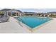 Community pool with plenty of lounge chairs, a cabana, and a play area at 952 Elwood St, Dacula, GA 30019