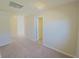 Clean and bright hallway with neutral carpeting at 2414 Allsborough Way, Dacula, GA 30019